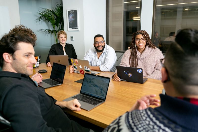 People sitting around a meeting table